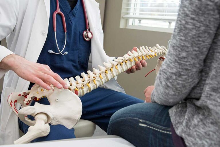 Person wearing a neutral wrist splint while resting a hand beside household tools.